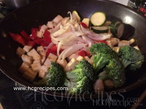 HCG Diet Phase 3 Menu and Foods: broccoli, red bell pepper, onions, chicken, zucchini, paneer cheese in skillet
