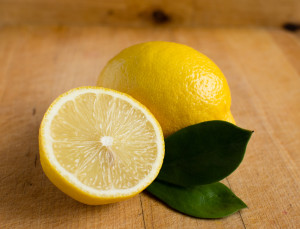 Lemon and cut lemon on table to make Stevia Lemonade Recipe