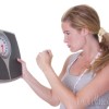 HCG Diet Plateaus woman angry at the scale
