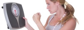 HCG Diet Plateaus woman angry at the scale