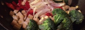 HCG Diet Phase 3 Menu and Foods: broccoli, red bell pepper, onions, chicken, zucchini, paneer cheese in skillet